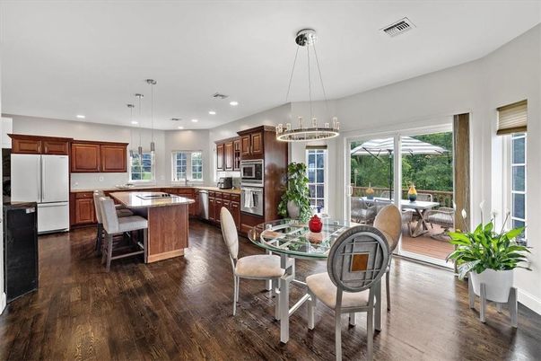 Chandelier, Dining room, Interior, Kitchen, Pendant Lights, Recessed Lighting, Stainless Steel Appliances, Wood Texture Flooring