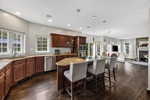 Fireplace, Interior, Kitchen, Pendant Lights, Recessed Lighting, Stainless Steel Appliances, Wood Texture Flooring