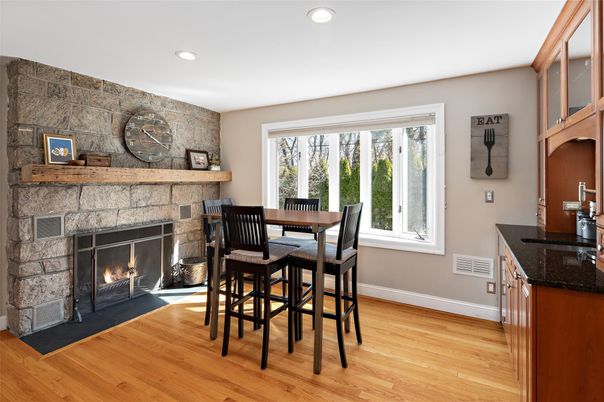 Dining room, Fireplace, Interior, Recessed Lighting, Stone Walls, Wood Texture Flooring