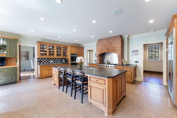 Fireplace, Interior, Kitchen, Recessed Lighting, Stainless Steel Appliances, Stone Walls
