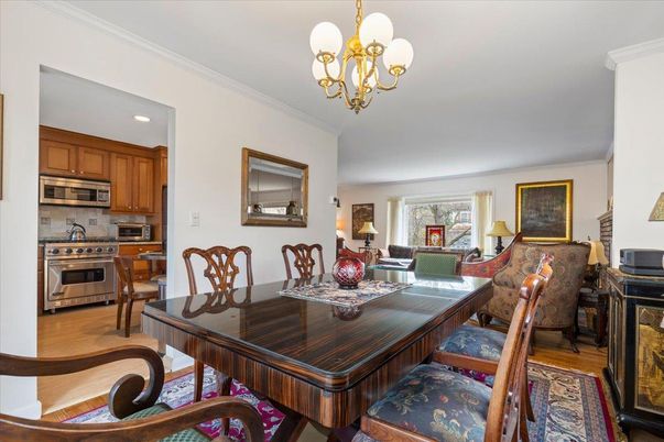Chandelier, Dining room, Interior, Kitchen, Recessed Lighting, Stainless Steel Appliances, Wood Texture Flooring