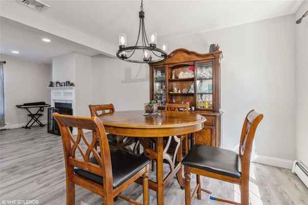 Chandelier, Dining room, Fireplace, Interior, Pendant Lights, Recessed Lighting, Wood Texture Flooring