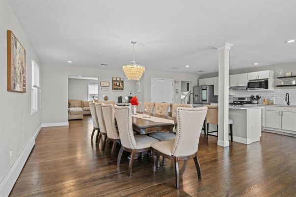 Chandelier, Dining room, Interior, Kitchen, Recessed Lighting, Stainless Steel Appliances, Wood Texture Flooring