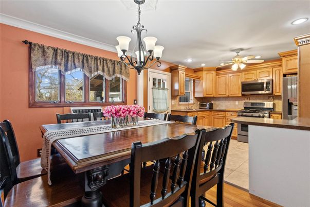 Chandelier, Dining room, Interior, Kitchen, Recessed Lighting, Stainless Steel Appliances, Wood Texture Flooring