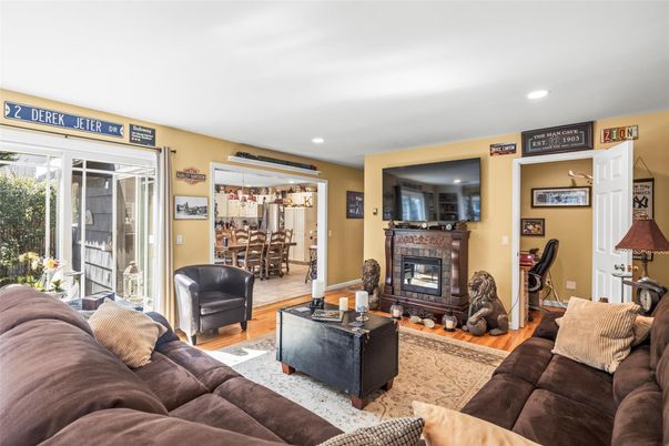 Dining room, Fireplace, Interior, Living room, Recessed Lighting, Wood Texture Flooring