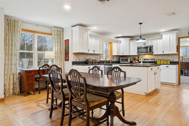 Dining room, Interior, Kitchen, Pendant Lights, Recessed Lighting, Stainless Steel Appliances, Wood Texture Flooring