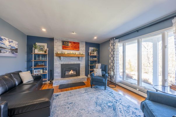 Fireplace, Interior, Living room, Recessed Lighting, Stone Walls, Wood Texture Flooring