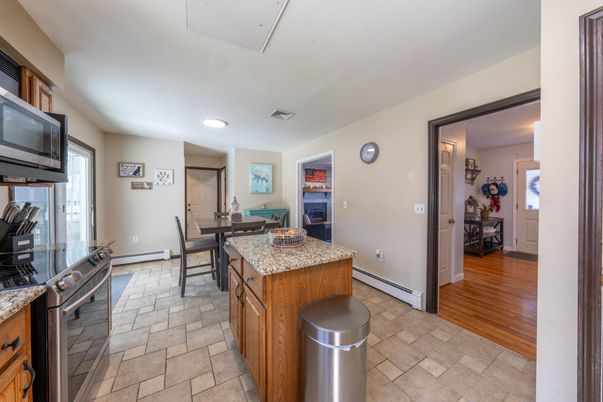 Dining room, Fireplace, Interior, Kitchen, Recessed Lighting, Wood Texture Flooring