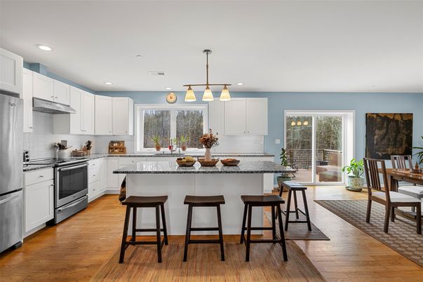 Dining room, Interior, Kitchen, Pendant Lights, Recessed Lighting, Stainless Steel Appliances, Wood Texture Flooring