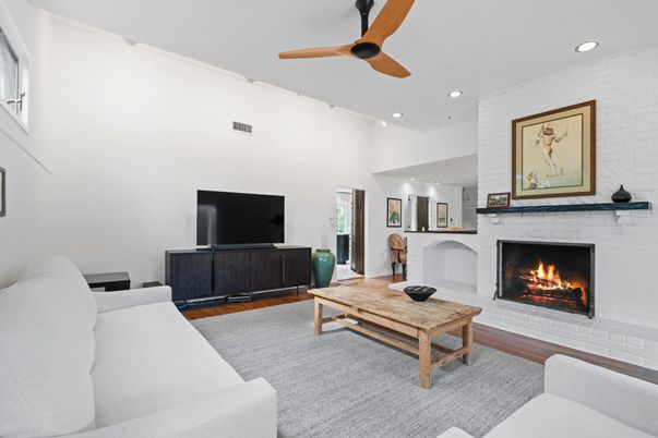 Fireplace, Interior, Living room, Recessed Lighting, Stone Walls, Wood Texture Flooring