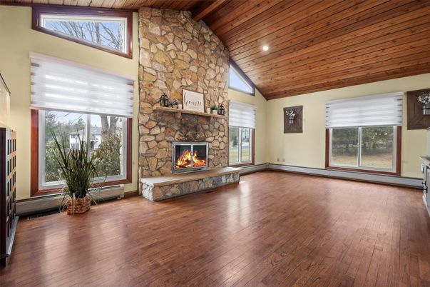 Empty room, Fireplace, Interior, Recessed Lighting, Stone Walls, Wooden Beams, Wooden Ceilings, Wood Texture Flooring