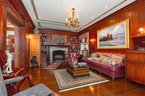 Chandelier, Fireplace, Interior, Living room, Recessed Lighting, Wood Texture Flooring, Wooden Walls