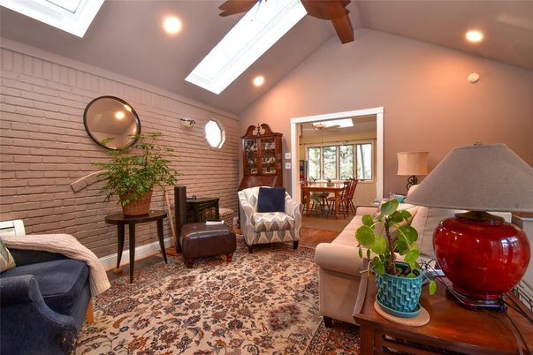 Dining room, Fireplace, Interior, Living room, Recessed Lighting, Stone Walls, Wooden Beams, Wood Texture Flooring