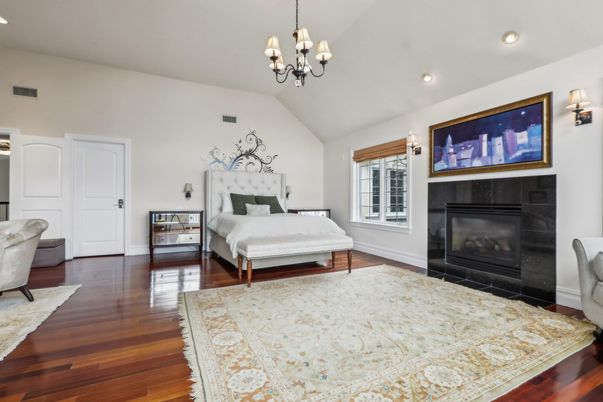 Bedroom, Chandelier, Fireplace, Interior, Recessed Lighting, Wood Texture Flooring