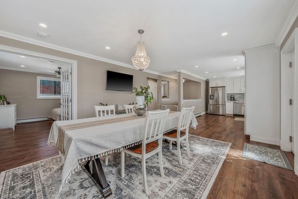 Chandelier, Dining room, Interior, Kitchen, Recessed Lighting, Stainless Steel Appliances, Wood Texture Flooring