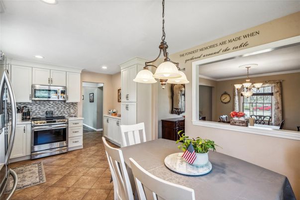 Chandelier, Dining room, Interior, Kitchen, Pendant Lights, Recessed Lighting, Stainless Steel Appliances