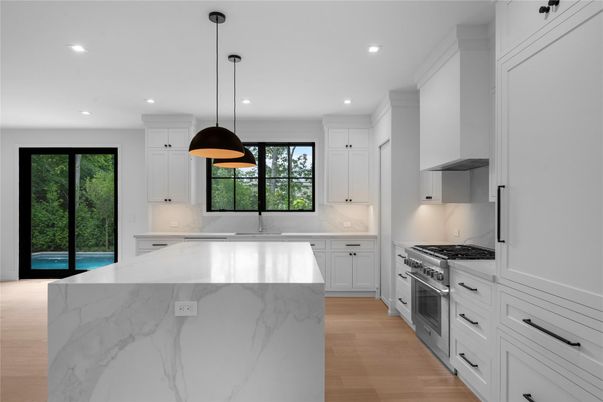 Interior, Kitchen, Marble Walls, Pendant Lights, Recessed Lighting, Stainless Steel Appliances, Wood Texture Flooring