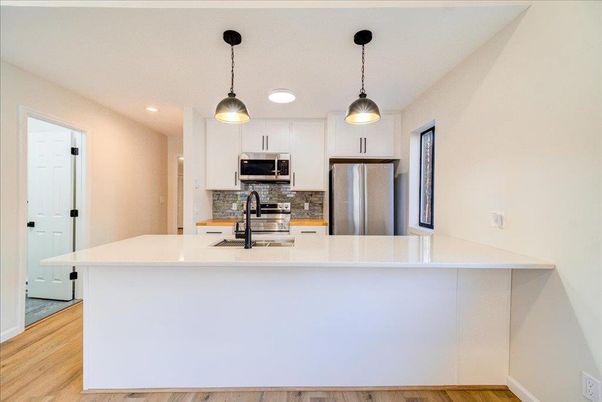 Interior, Kitchen, Pendant Lights, Recessed Lighting, Stainless Steel Appliances, Wood Texture Flooring