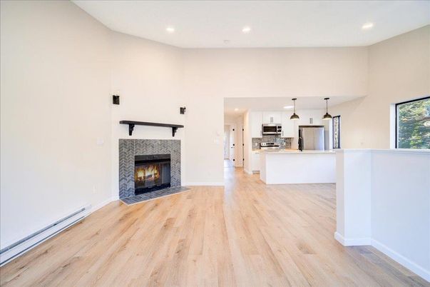 Fireplace, Interior, Kitchen, Pendant Lights, Recessed Lighting, Stainless Steel Appliances, Wood Texture Flooring