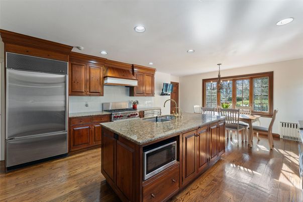 Dining room, Interior, Kitchen, Pendant Lights, Recessed Lighting, Stainless Steel Appliances, Wood Texture Flooring