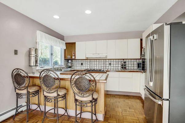 Interior, Kitchen, Recessed Lighting, Stainless Steel Appliances, Tile Countertops, Wood Texture Flooring