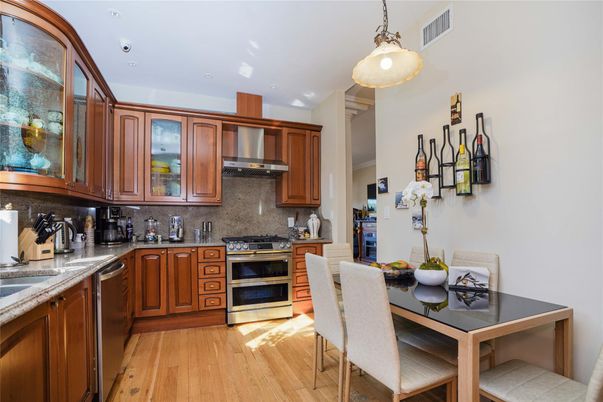 Dining room, Interior, Kitchen, Pendant Lights, Recessed Lighting, Stainless Steel Appliances, Wood Texture Flooring