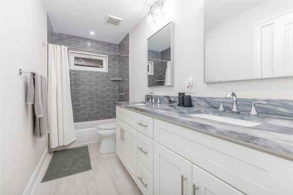 Bathroom, Dual Sink Vanities, Interior, Recessed Lighting, Wood Texture Flooring