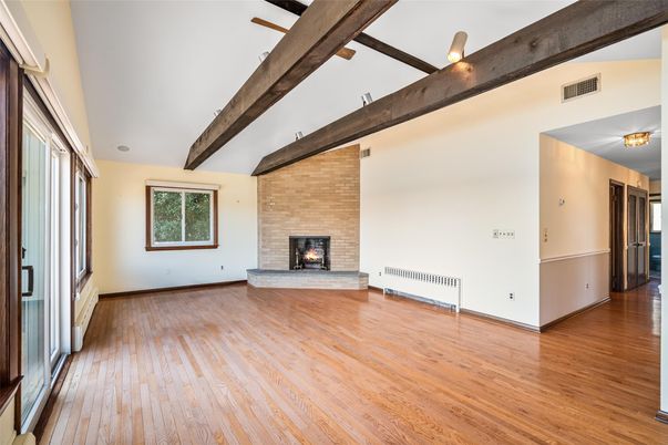 Empty room, Fireplace, Interior, Stone Walls, Wooden Beams, Wood Texture Flooring