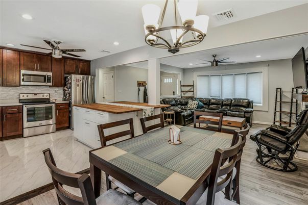 Chandelier, Dining room, Interior, Kitchen, Living room, Marble, Recessed Lighting, Stainless Steel Appliances, Wood Texture Flooring