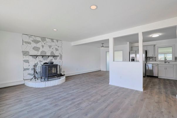 Fireplace, Interior, Kitchen, Recessed Lighting, Stainless Steel Appliances, Wood Texture Flooring
