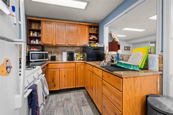 Interior, Kitchen, Recessed Lighting, Tile Countertops, Wood Texture Flooring