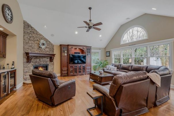 Fireplace, Interior, Living room, Recessed Lighting, Stone Walls, Wood Texture Flooring