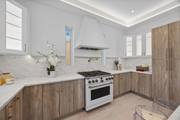 Interior, Kitchen, Marble Walls, Recessed Lighting, Stainless Steel Appliances, Wood Texture Flooring