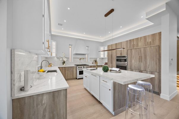 Interior, Kitchen, Marble Walls, Recessed Lighting, Stainless Steel Appliances, Wood Texture Flooring