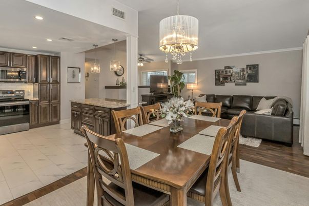 Chandelier, Dining room, Interior, Kitchen, Living room, Marble, Pendant Lights, Recessed Lighting, Stainless Steel Appliances, Wood Texture Flooring