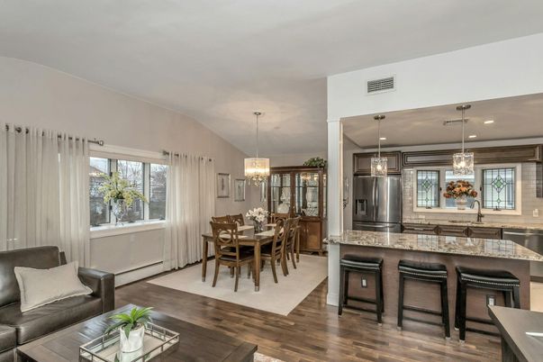 Chandelier, Dining room, Interior, Kitchen, Living room, Pendant Lights, Recessed Lighting, Stainless Steel Appliances, Wood Texture Flooring