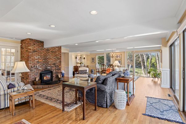 Chandelier, Dining room, Fireplace, Interior, Living room, Recessed Lighting, Stone Walls, Wood Texture Flooring