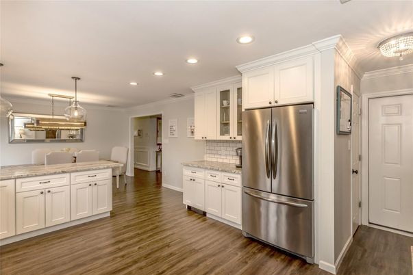 Dining room, Interior, Kitchen, Pendant Lights, Recessed Lighting, Stainless Steel Appliances, Wood Texture Flooring
