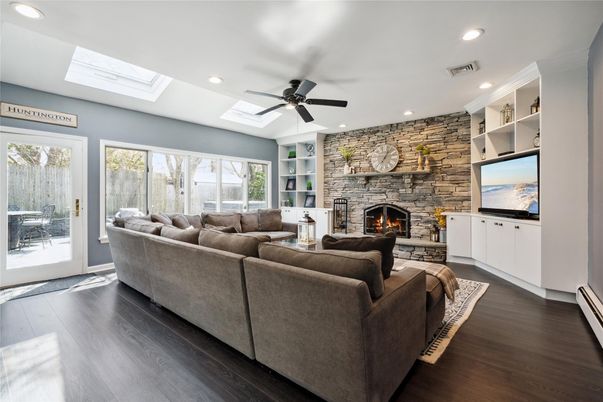 Fireplace, Interior, Living room, Recessed Lighting, Stone Walls, Wood Texture Flooring