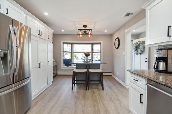 Dining room, Interior, Kitchen, Recessed Lighting, Stainless Steel Appliances, Wood Texture Flooring