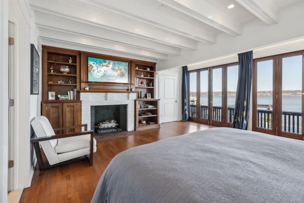 Bedroom, Fireplace, Interior, Recessed Lighting, Water, Wood Texture Flooring