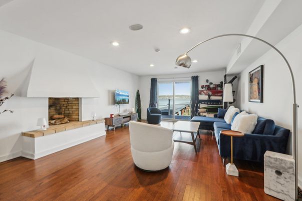 Fireplace, Interior, Living room, Recessed Lighting, Stone Walls, Wood Texture Flooring