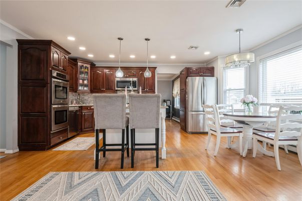 Dining room, Interior, Kitchen, Pendant Lights, Recessed Lighting, Stainless Steel Appliances, Wood Texture Flooring