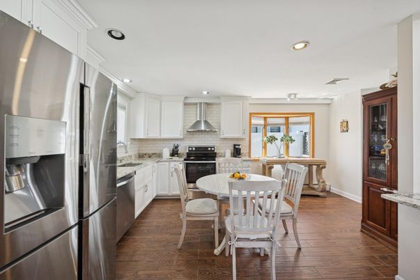 Dining room, Interior, Kitchen, Recessed Lighting, Stainless Steel Appliances, Wood Texture Flooring