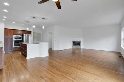 Empty room, Interior, Kitchen, Pendant Lights, Recessed Lighting, Stainless Steel Appliances, Wood Texture Flooring