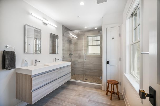 Bathroom, Dual Sink Vanities, Glass Shower, Interior, Recessed Lighting, Wood Texture Flooring
