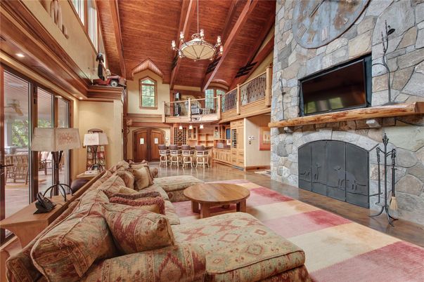 Chandelier, Dining room, Fireplace, Interior, Living room, Recessed Lighting, Stone Walls, Wooden Beams, Wooden Ceilings, Wood Texture Flooring