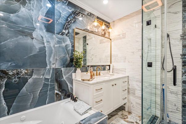 Bathroom, Dual Sink Vanities, Glass Shower, Interior, Marble Walls, Recessed Lighting