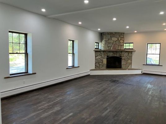 Empty room, Fireplace, Interior, Recessed Lighting, Stone Walls, Wood Texture Flooring