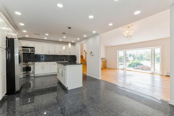 Chandelier, Interior, Kitchen, Pendant Lights, Recessed Lighting, Stainless Steel Appliances, Wood Texture Flooring